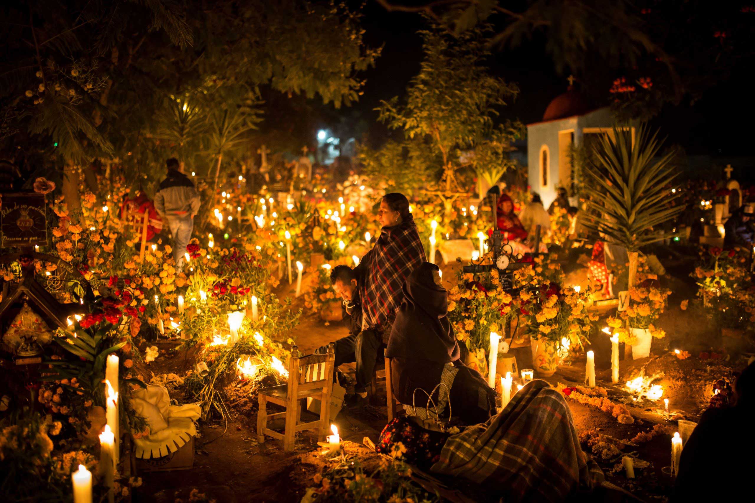 Candles illuminate a large public display